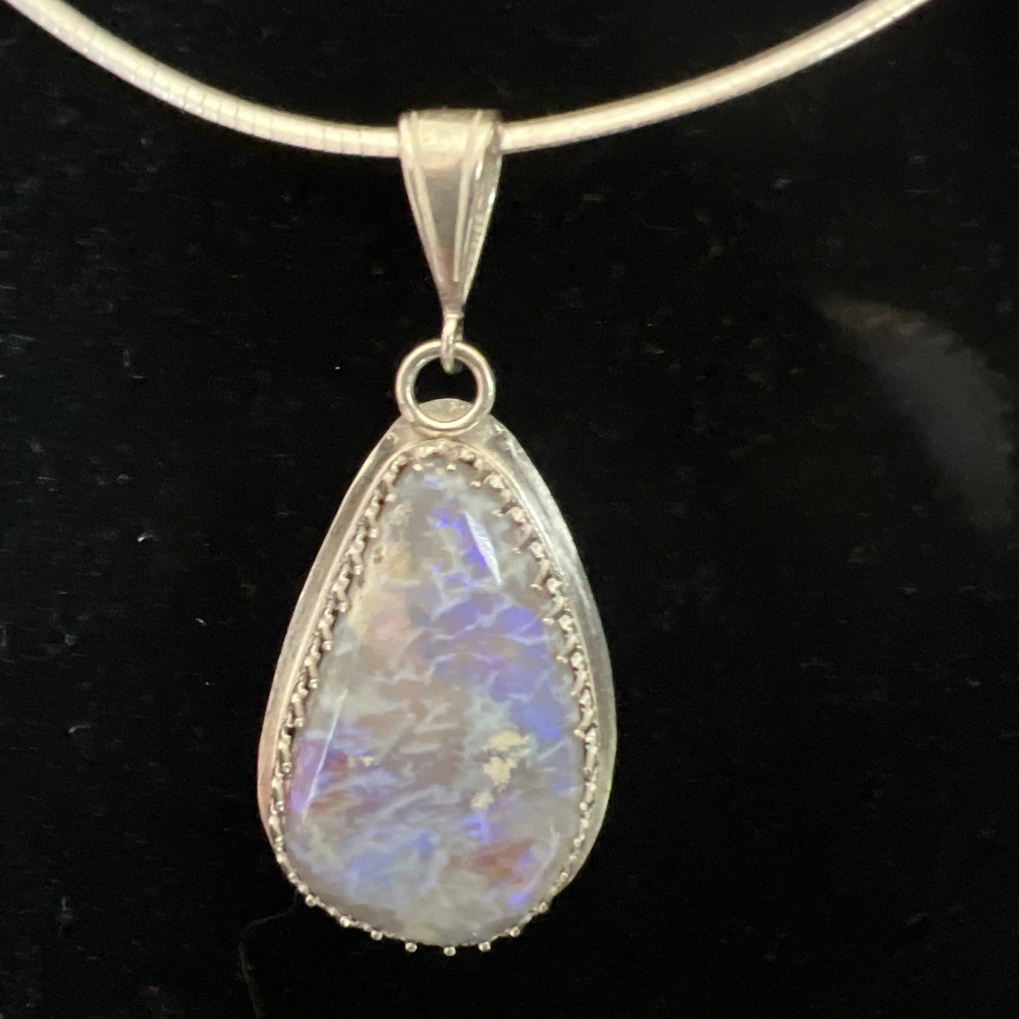 Oval opal pendant on omega chain