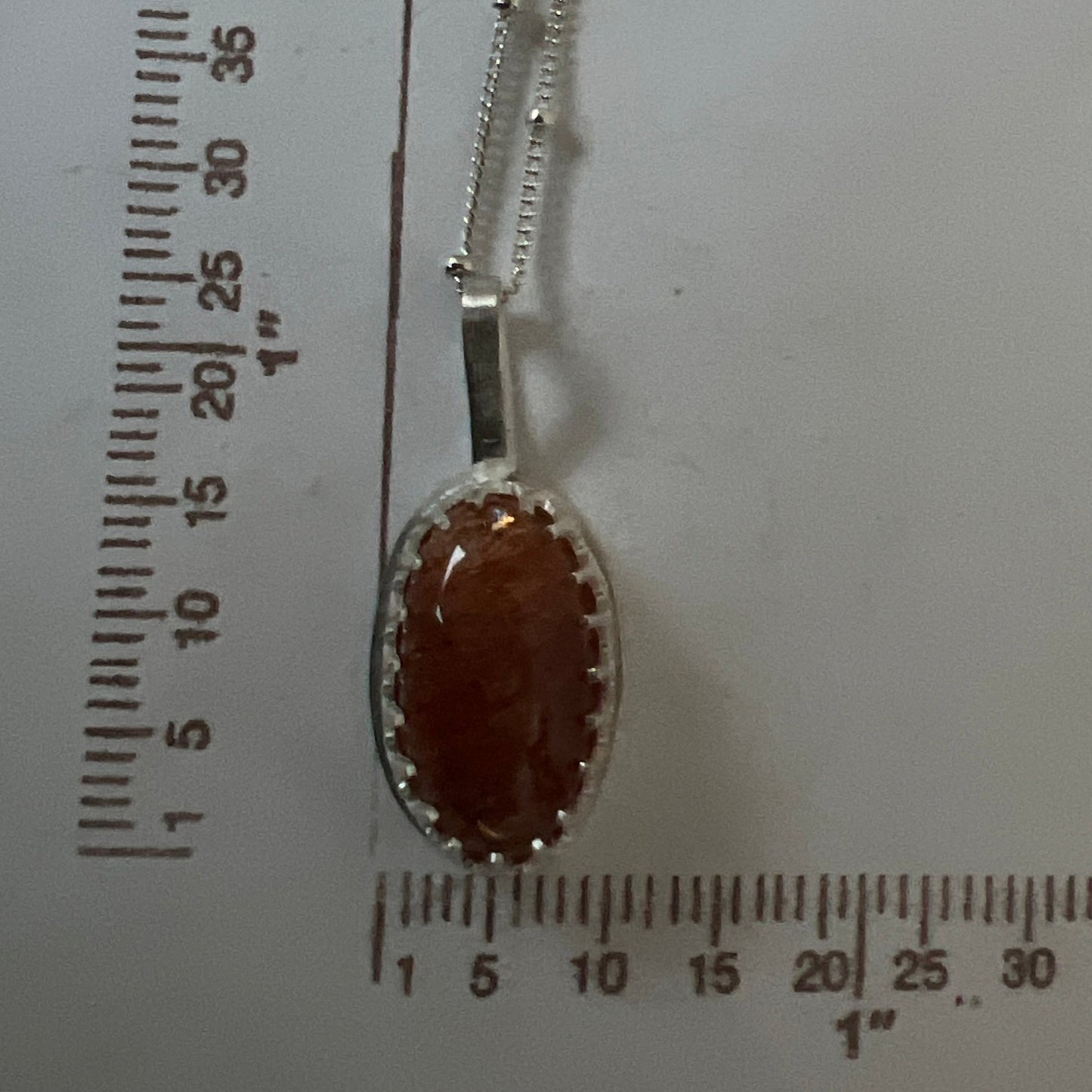 long oval sunstone sterling silver pendant