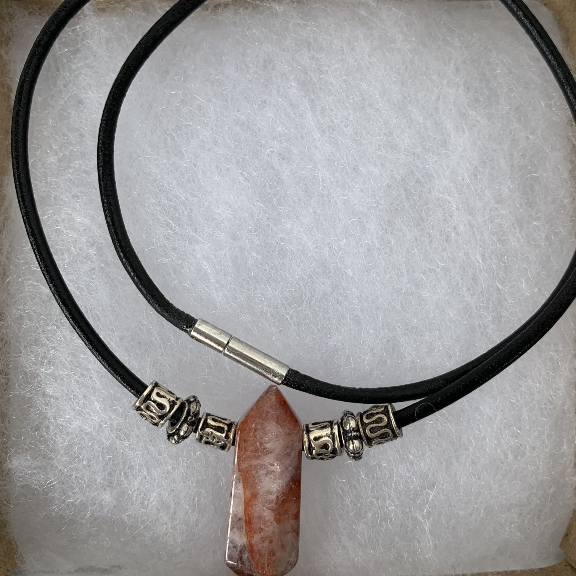 natural red quartz with tibetan beads on leather cord