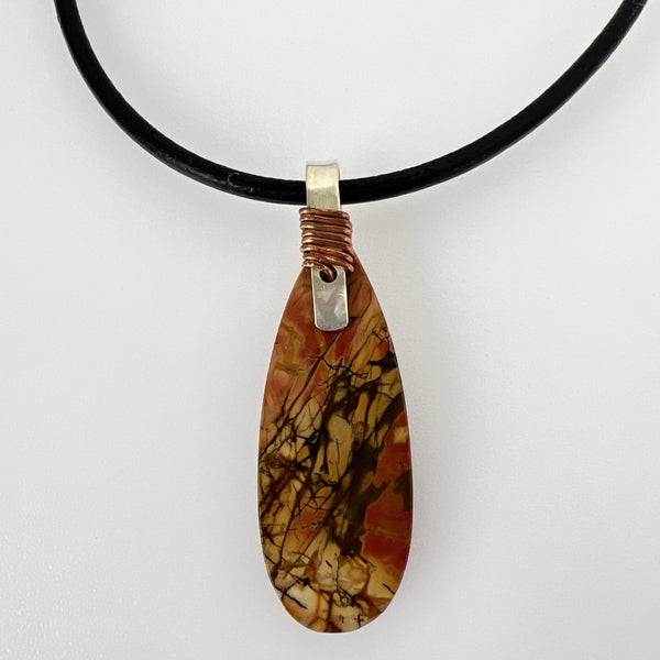 Natural Red Creek Jasper pendant on sterling silver handwrapped with copper wire no 20" leather cord