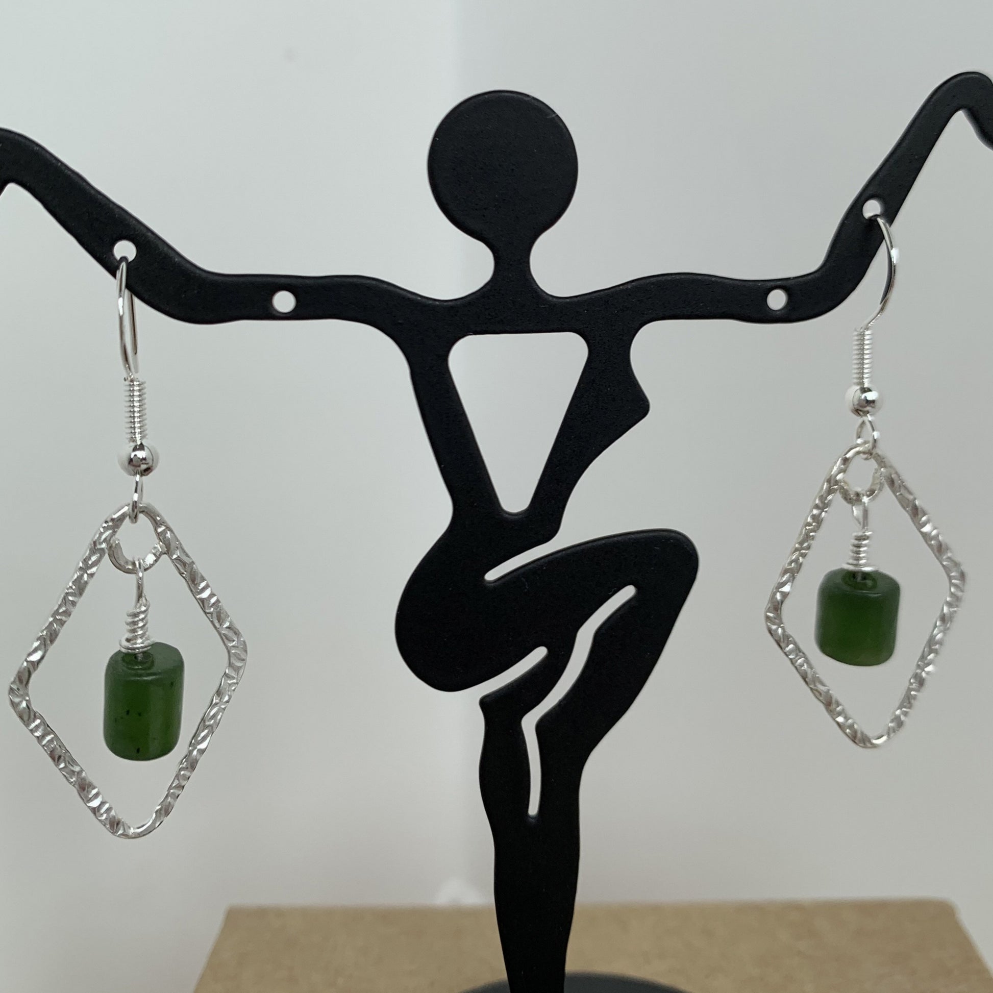 natural Canadian jade wire wrapped and dangled on sterling silver trapeszoid frame with sterling silver ear wire